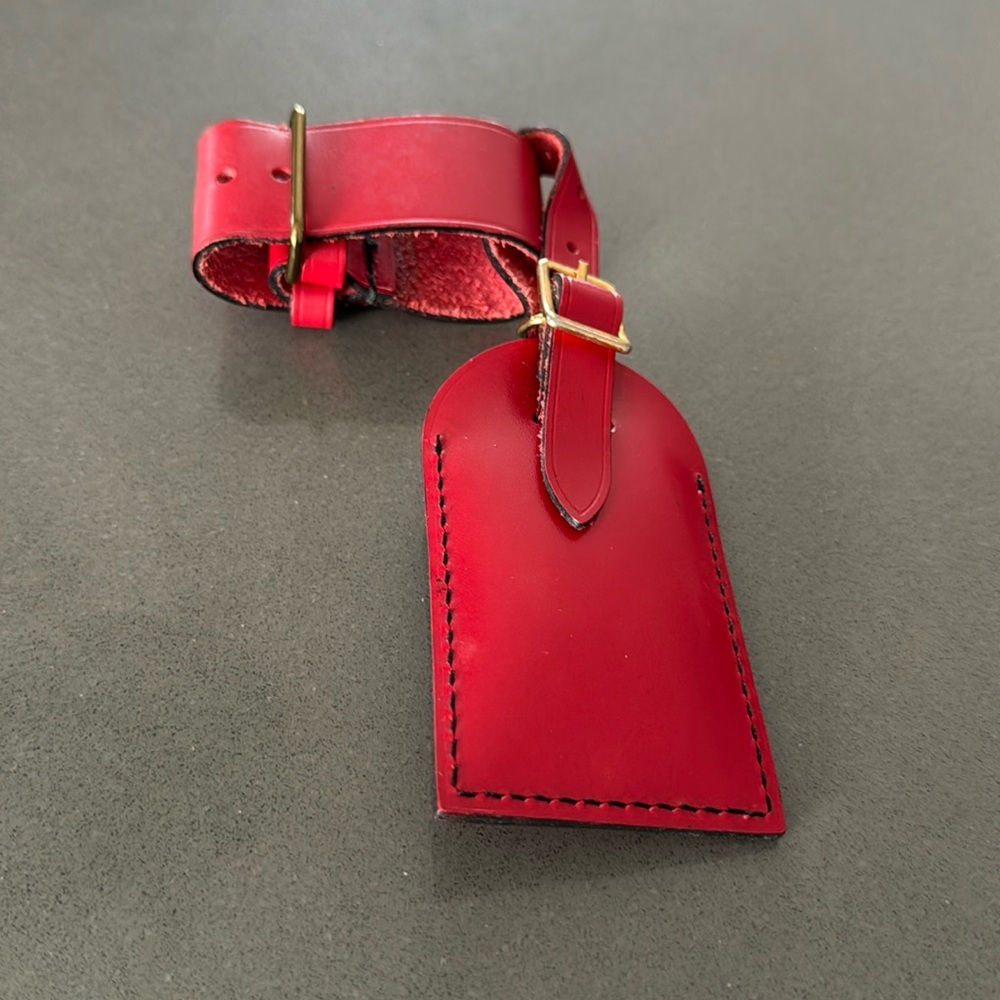 Louis Vuitton Pre loved authentic in great condition Red Luggage Tag.